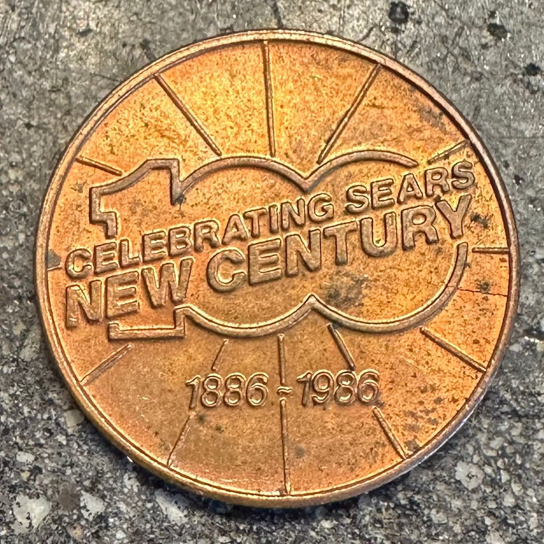 U.S. Authentic Copper Statue of Liberty Token back on a dark grey concrete background. - Mountainstruck Coin Jewelry