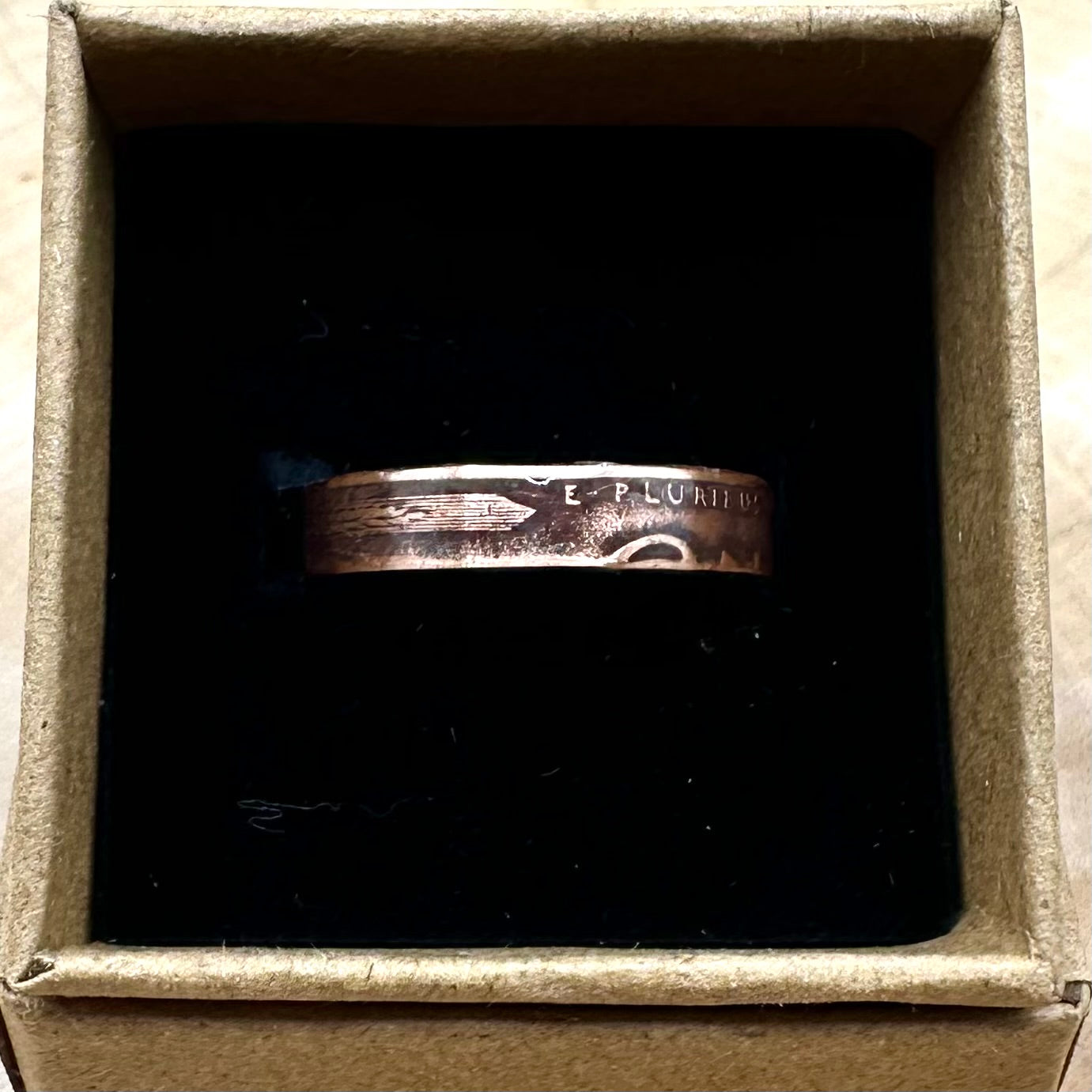 Wheat Penny Coin Ring in a brown kraft box on a black velvet background. - Mountainstruck Coin Jewelry