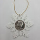 2025 Half Dollar Christmas Ornament  with an uncirculated half dollar cased inside a white 3D printed snowflake with golden tassel on a white background. - Mountainstruck Coin Jewelry