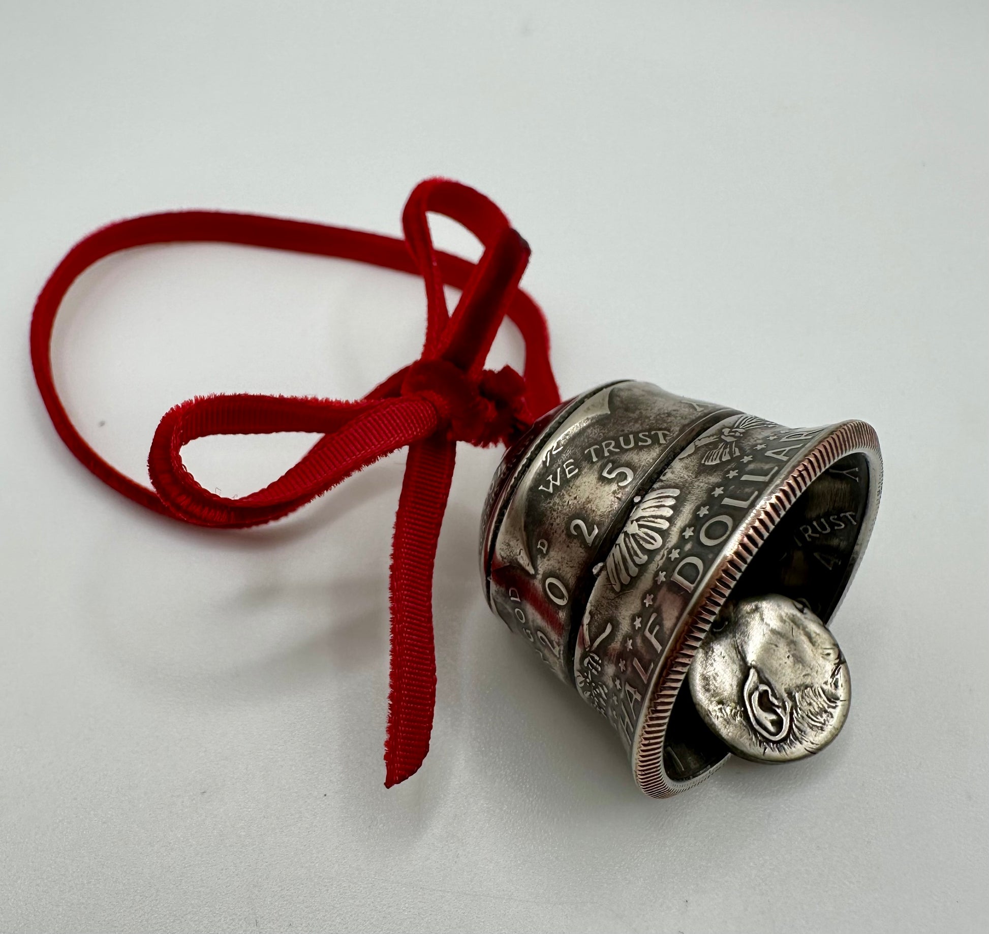 2025 Holiday Coin Bell Ornament Works! with a red bow on a white background. - Mountainstruck Coin Jewelry