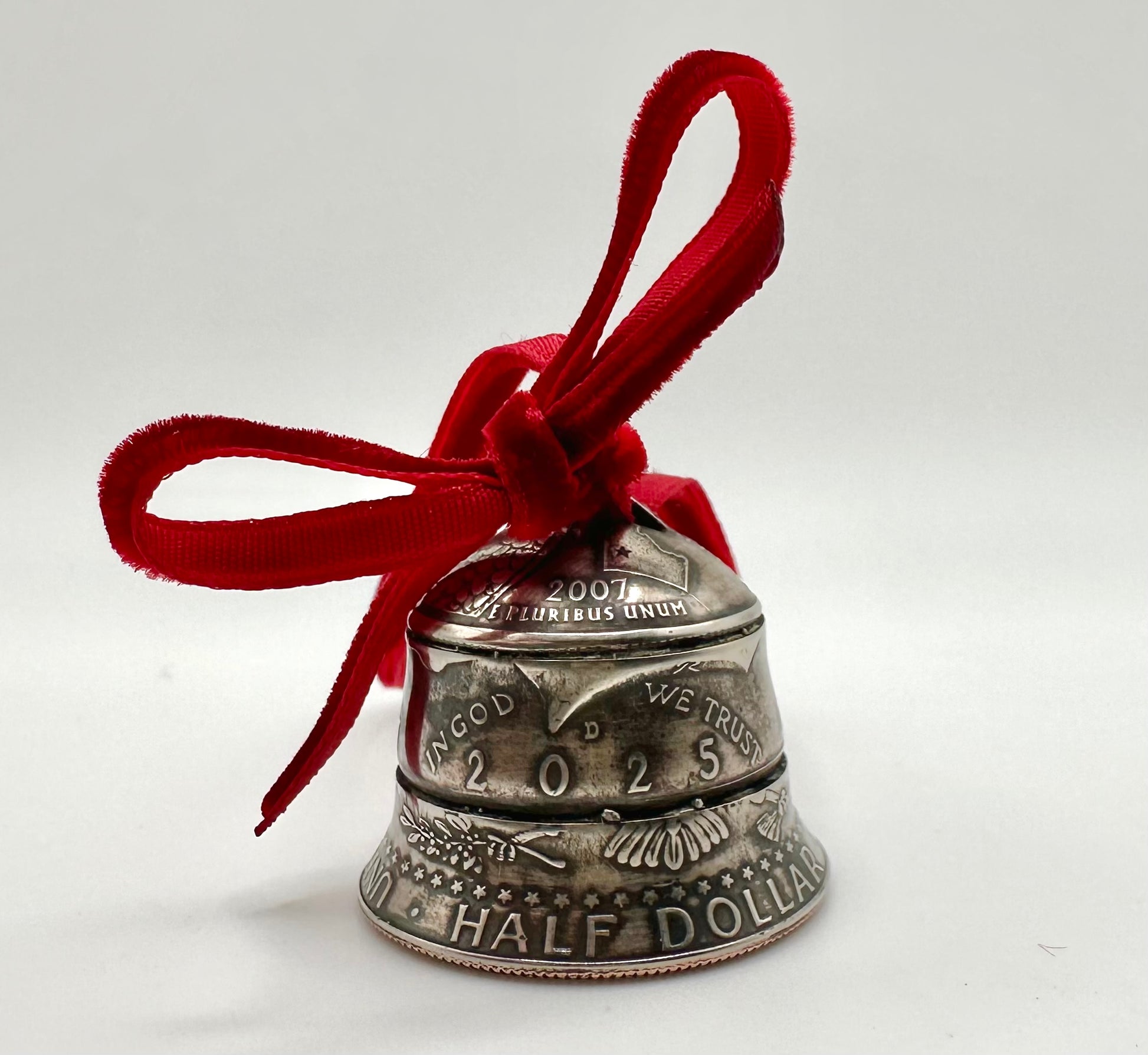 2025 Holiday Coin Bell Ornament Works! with a red bow on a white background. - Mountainstruck Coin Jewelry