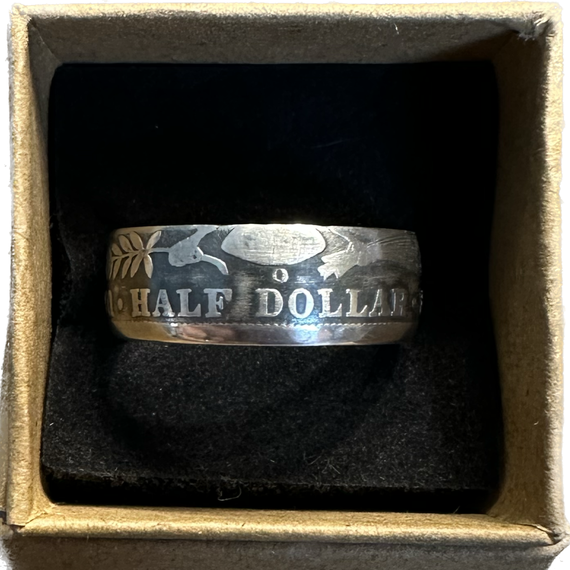 Barber Half Dollar Silver Coin Ring (reverse) in a brown kraft box on a black velvet background. - Mountainstruck Coin Jewelry