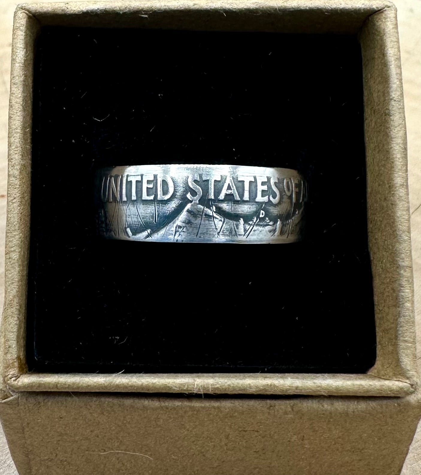 Ben Franklin Half Dollar Silver Coin Ring in a brown kraft box on a black velvet background. - Mountainstruck Coin Jewelry