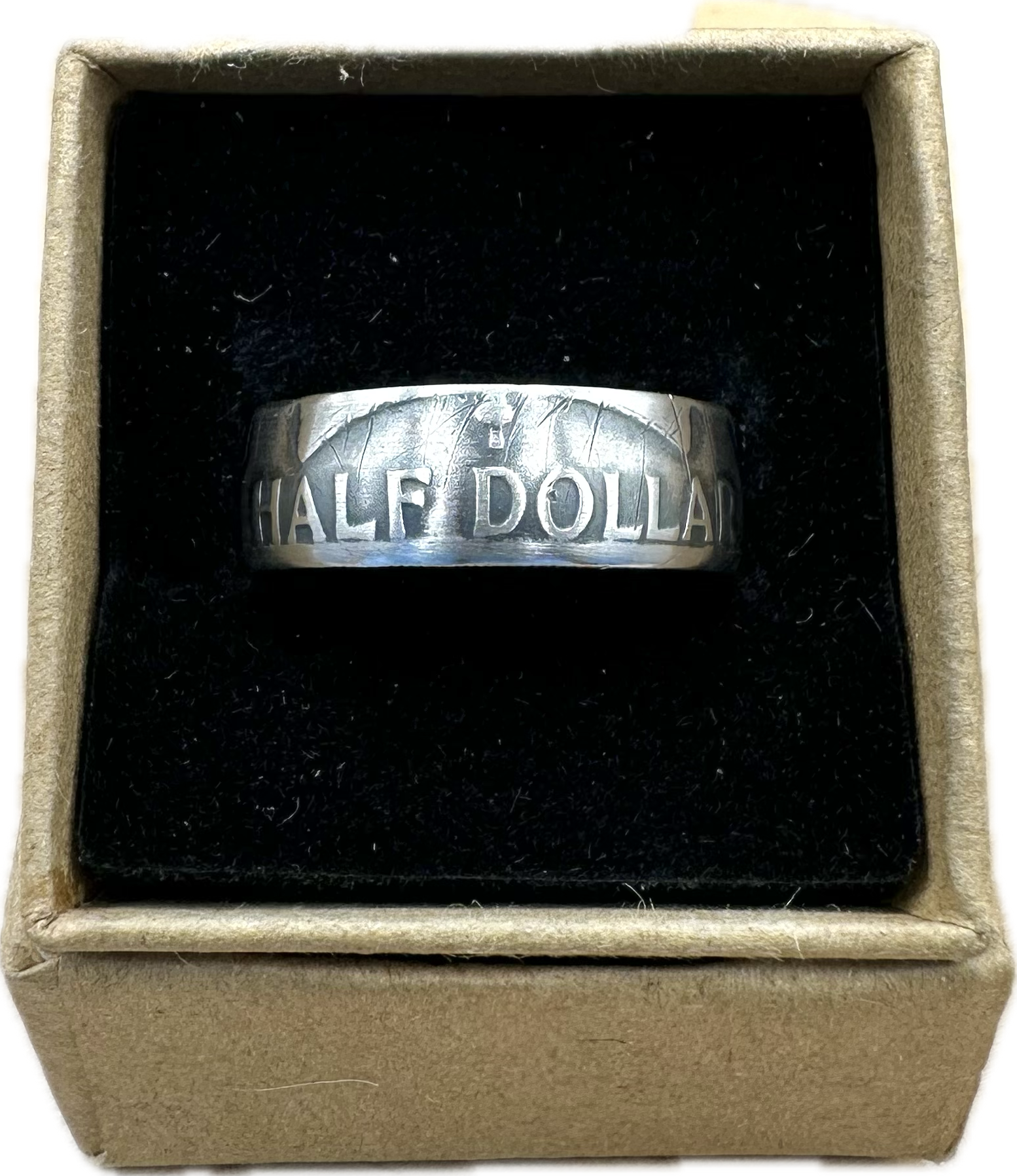 Ben Franklin Half Dollar Silver Coin Ring in a brown kraft box on a black velvet background. - Mountainstruck Coin Jewelry