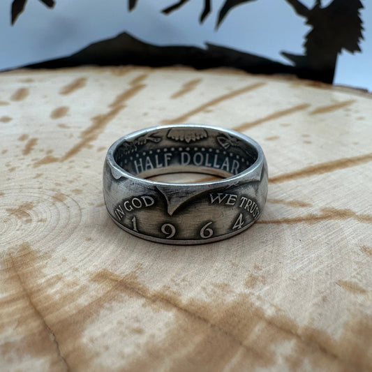 JFK 1964 Half Dollar Silver Coin Ring on a wood background. - Mountainstruck Coin Jewelry
