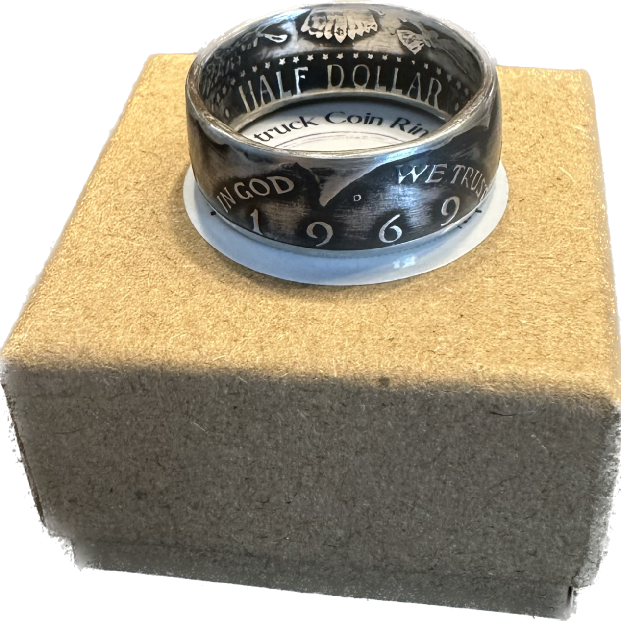 JFK Silver Half Dollar Coin Ring (front) on a brown kraft box. - Mountainstruck Coin Jewelry