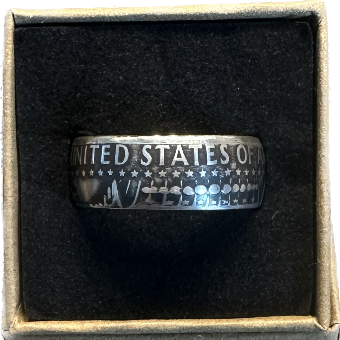 JFK Silver Half Dollar Coin Ring (reverse) in a brown kraft box on a black velvet background. - Mountainstruck Coin Jewelry