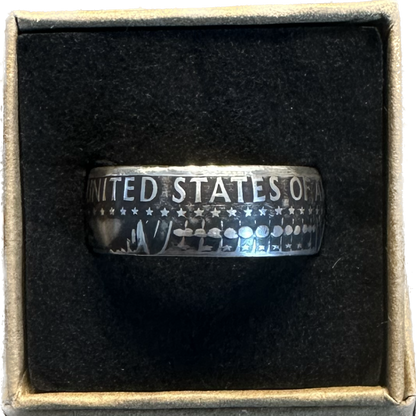 JFK Silver Half Dollar Coin Ring (reverse) in a brown kraft box on a black velvet background. - Mountainstruck Coin Jewelry