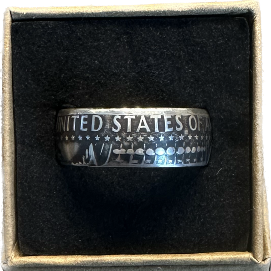 JFK Silver Half Dollar Coin Ring (reverse) in a brown kraft box on a black velvet background. - Mountainstruck Coin Jewelry