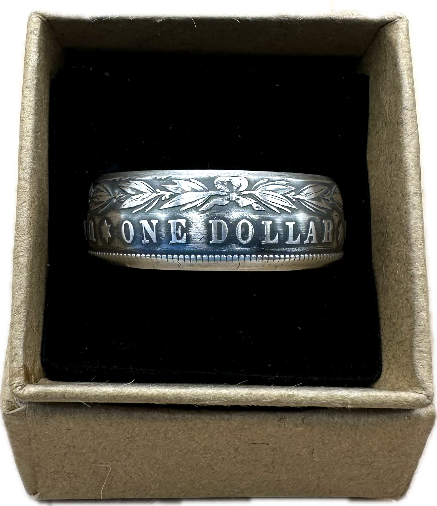 Morgan Dollar Silver Coin Ring in a brown kraft box on a black velvet background. - Mountainstruck Coin Jewelry