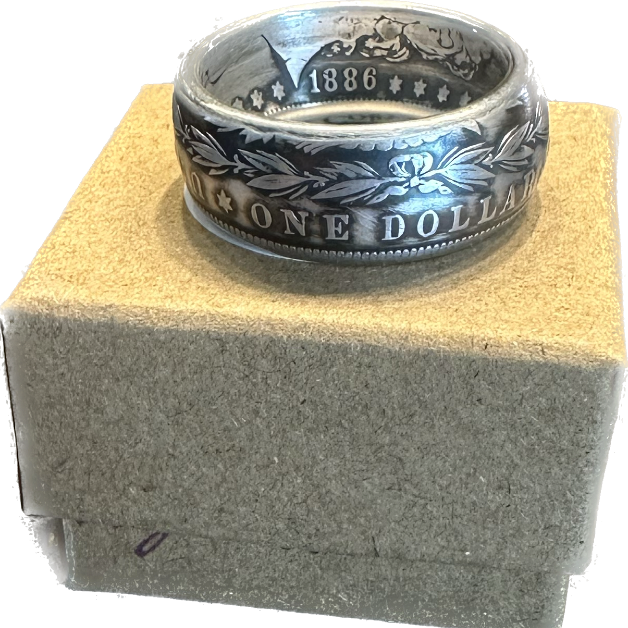 Morgan Dollar Silver Coin Ring on a brown kraft box. - Mountainstruck Coin Jewelry