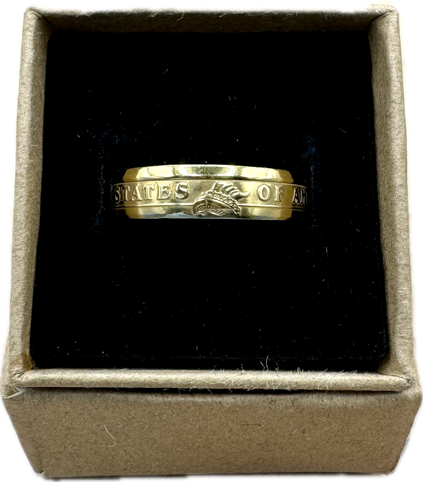 Presidential Dollar Coin Ring (Reverse) 24k Gold Plated in a brown kraft box on a black velvet background. - Mountainstruck Coin Jewelry