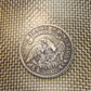 (Rare) Capped Bust Liberty Silver Half Dollar back of coin on a plastic woven background. - Mountainstruck Coin Jewelry
