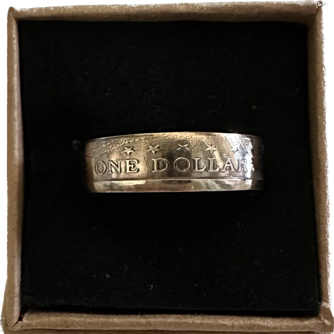 Sacagawea Dollar Coin Ring in a brown kraft box on a black velvet background.- Mountainstruck Coin Jewelry