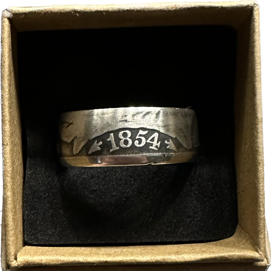Seated Liberty Silver Half Dollar Coin Ring (patina) in a brown kraft box on a black velvet background. - Mountainstruck Coin Jewelry