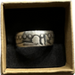 Seated Liberty Silver Half Dollar Coin Ring (patina) in a brown kraft box on a black velvet background. - Mountainstruck Coin Jewelry