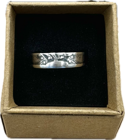 U.S. Standing Liberty Quarter Silver Coin Ring in a brown kraft box on a black velvet background. - Mountainstruck Coin Jewelry