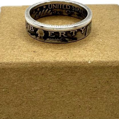 U.S. Standing Liberty Quarter Silver Coin Ring on a brown kraft box. - Mountainstruck Coin Jewelry
