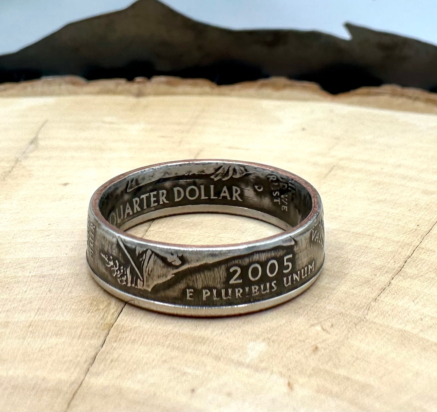 U.S. State Quarter Coin Ring featuring California on a light wood round with metal mountain background. - Mountainstruck Coin Jewelry