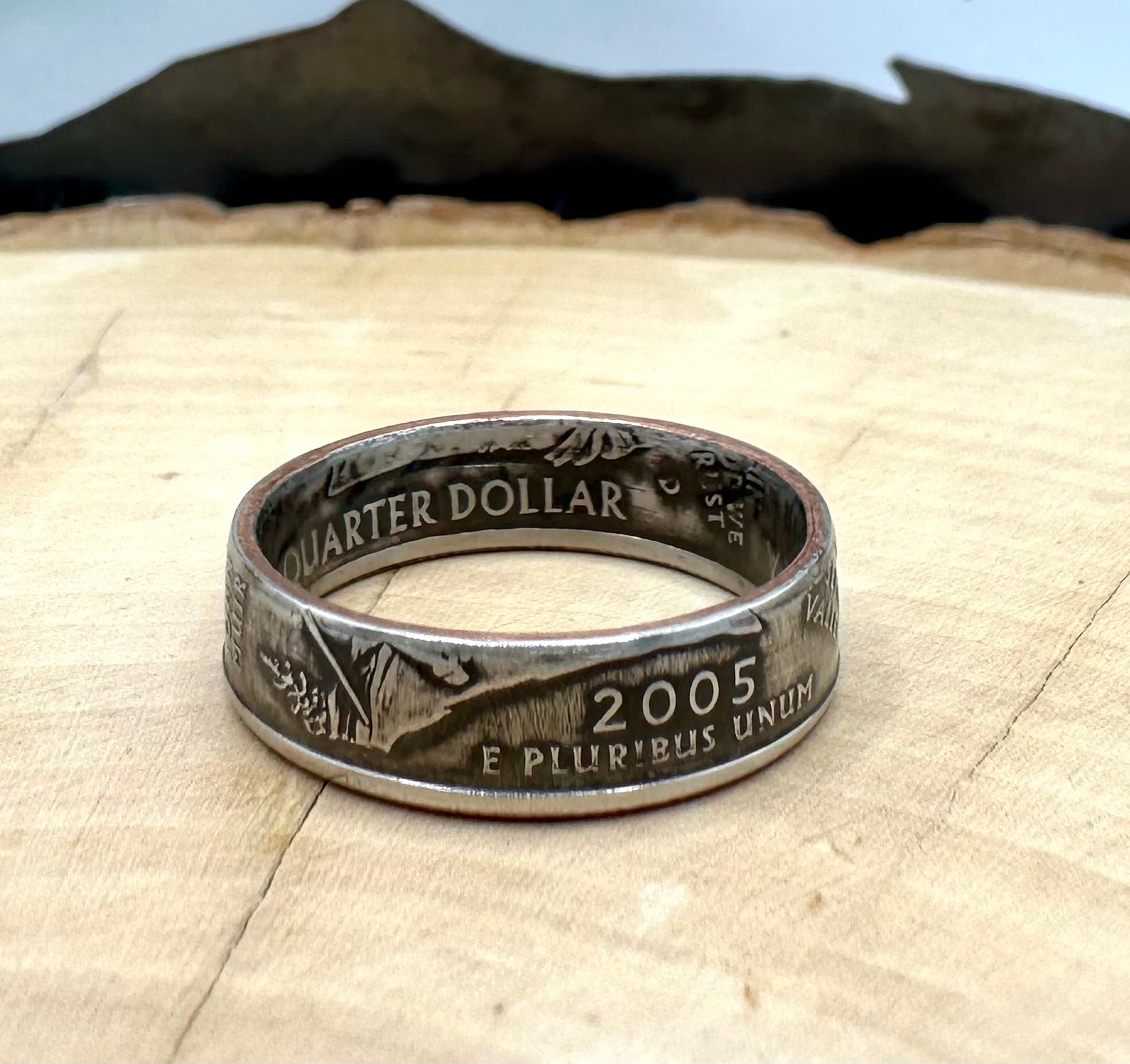 U.S. State Quarter Coin Ring featuring California on a light wood round with metal mountain background. - Mountainstruck Coin Jewelry