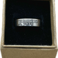 U.S. State Quarter Coin Ring featuring California in a brown kraft box on a black velvet background. - Mountainstruck Coin Jewelry