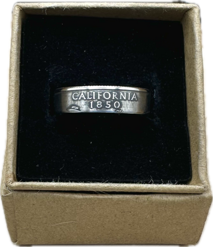 U.S. State Quarter Coin Ring featuring California in a brown kraft box on a black velvet background. - Mountainstruck Coin Jewelry