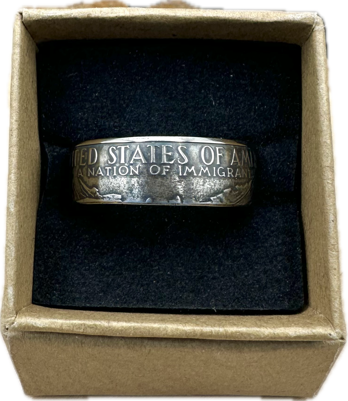 U.S. "A Nation of Immigrants" Half Dollar Coin Ring patina in a brown kraft box on a black velvet background. - Mountainstruck Coin Jewelry
