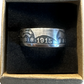 U.S. Barber Silver Half Dollar Coin Ring (front) in a brown kraft box on a black velvet background. - Mountainstruck Coin Jewelry