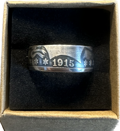 U.S. Barber Silver Half Dollar Coin Ring (front) in a brown kraft box on a black velvet background. - Mountainstruck Coin Jewelry