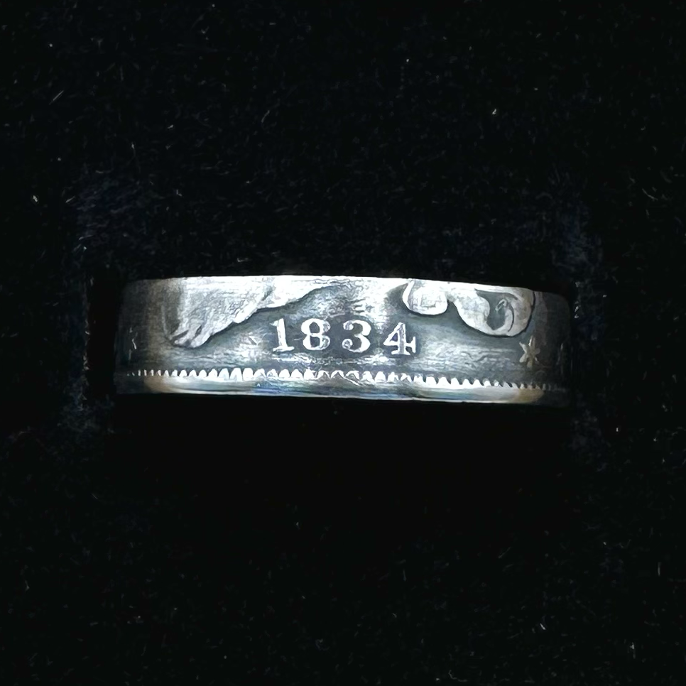 U.S. Capped Bust Liberty Quarter Silver Coin Ring in a brown kraft box on a black velvet background. - Mountainstruck Coin Jewelry