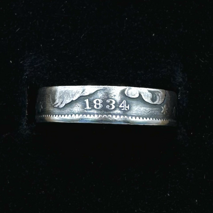 U.S. Capped Bust Liberty Quarter Silver Coin Ring in a brown kraft box on a black velvet background. - Mountainstruck Coin Jewelry