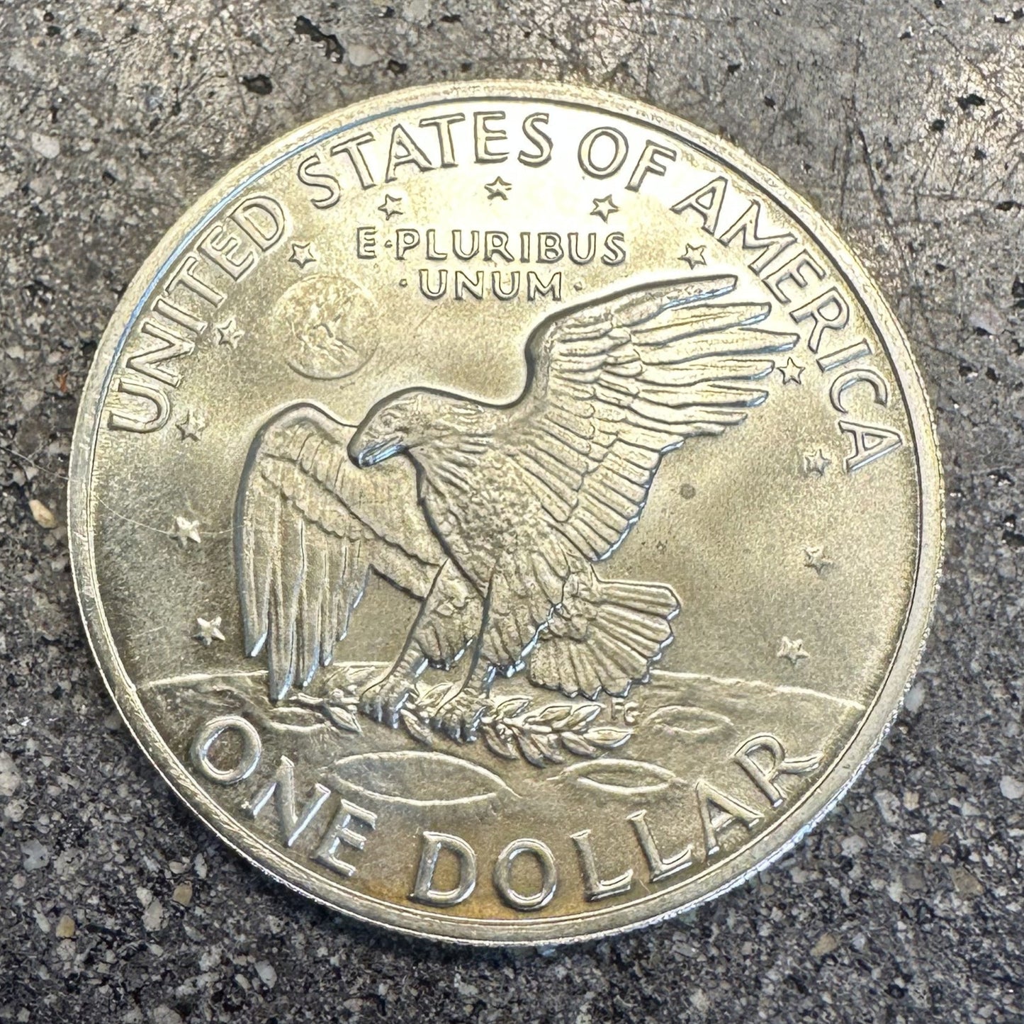 U.S. Eisenhower One Dollar 40% Silver Coin back on a dark concrete background. - Mountainstruck Coin Jewelry