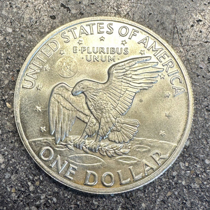 U.S. Eisenhower One Dollar 40% Silver Coin back on a dark concrete background. - Mountainstruck Coin Jewelry