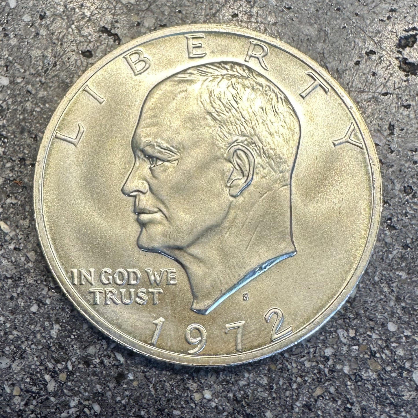 U.S. Eisenhower One Dollar 40% Silver Coin front on a dark concrete background. - Mountainstruck Coin Jewelry