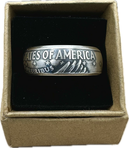 U.S. Eisenhower One Dollar 40% Silver Coin Ring in a brown kraft box on a black velvet background. - Mountainstruck Coin Jewelry