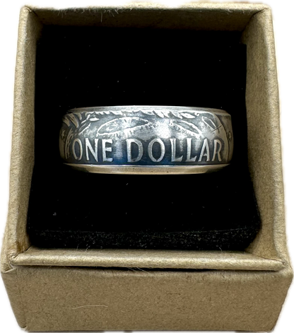 U.S. Eisenhower One Dollar 40% Silver Coin Ring in a brown kraft box on a black velvet background. - Mountainstruck Coin Jewelry