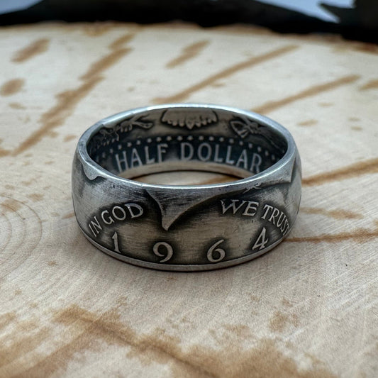 U.S. JFK 1964 Half Dollar Silver Coin Ring on a wood background. - Mountainstruck Coin Jewelry
