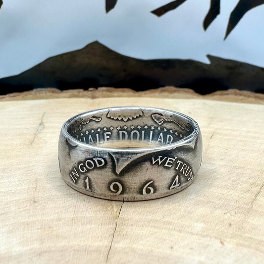 U.S. JFK 1964 Half Dollar Silver Coin Ring on a wood background. - Mountainstruck Coin Jewelry