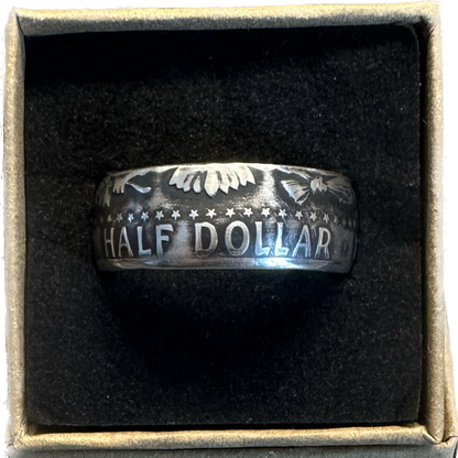 U.S. JFK Silver Half Dollar Coin Ring (reverse) in a brown kraft box on a black velvet background. - Mountainstruck Coin Jewelry