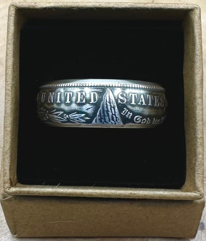 U.S. Morgan Dollar Silver Coin Ring patina in a brown kraft box on a black velvet background. - Mountainstruck Coin Jewelry