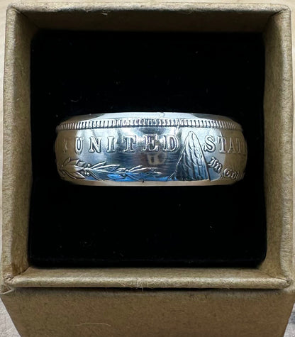 U.S. Morgan Dollar Silver Coin Ring shine in a brown kraft box on a black velvet background. - Mountainstruck Coin Jewelry