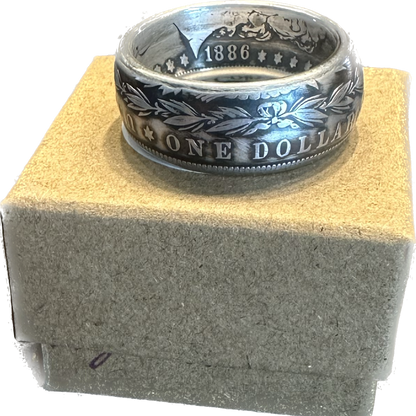 U.S. Morgan Dollar Silver Coin Ring, patina, on a brown kraft box. - Mountainstruck Coin Jewelry