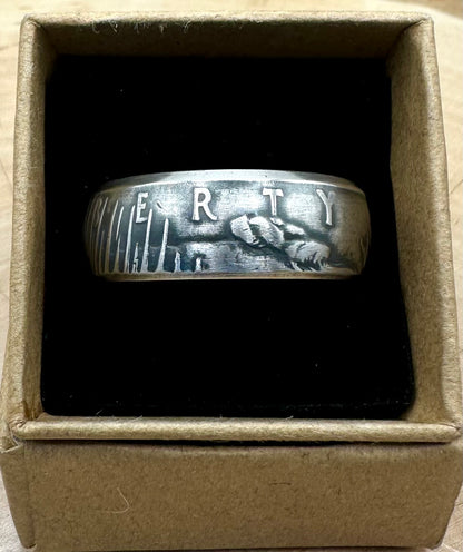 U.S. Peace Dollar Silver Coin Ring in a brown kraft box on a black velvet background. - Mountainstruck Coin Jewelry