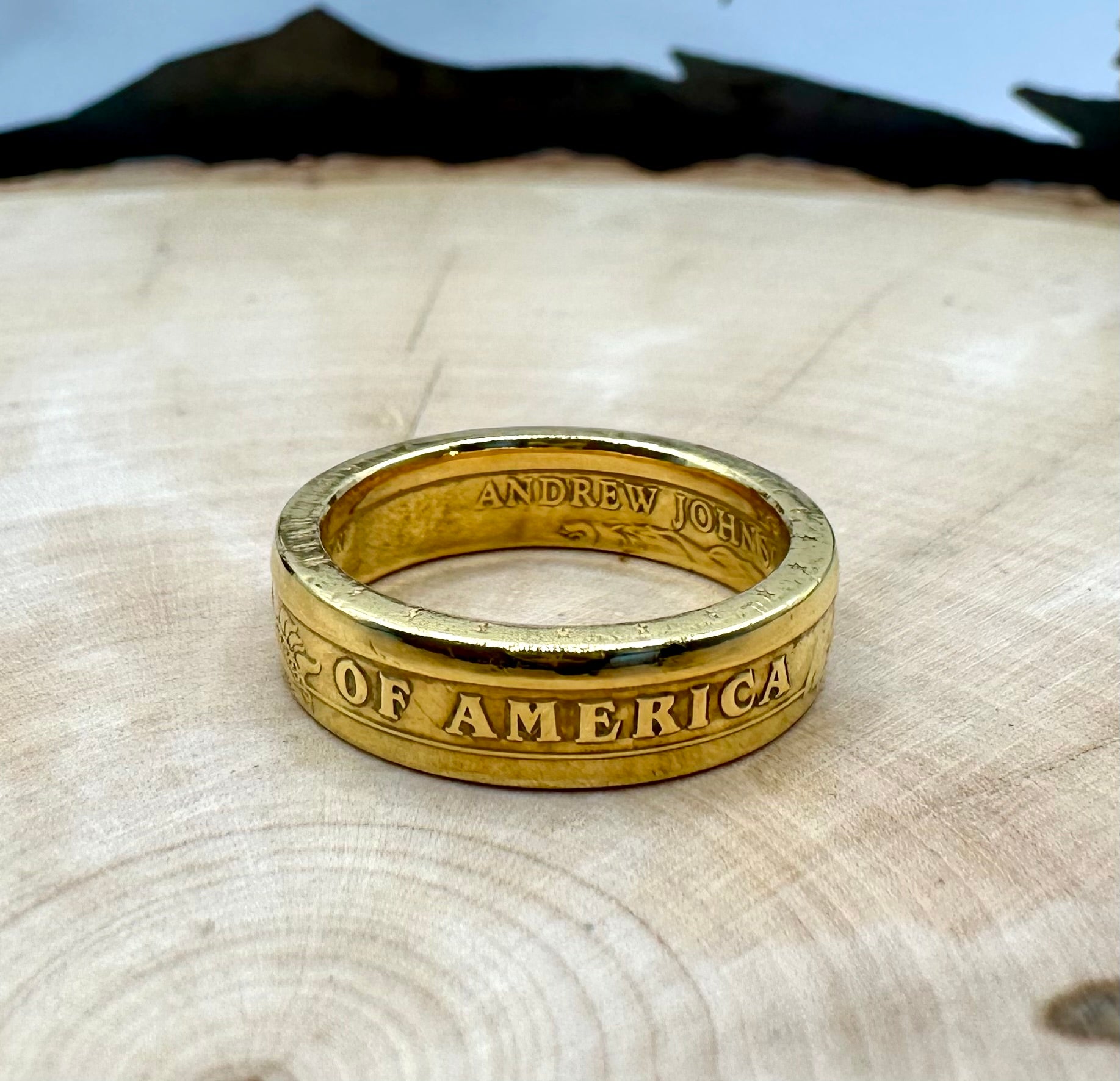 U.S. Presidential Dollar Coin Ring (Reverse) 24k Gold Plated on a light wood round with a metal mountain background. - Mountainstruck Coin Jewelry