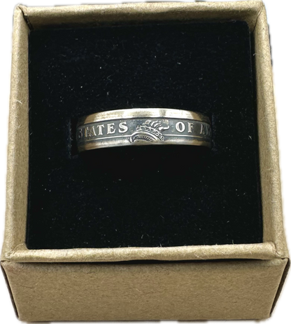 U.S. Presidential Dollar Coin Ring (Reverse) patina in a brown kraft box on a black velvet background. - Mountainstruck Coin Jewelry