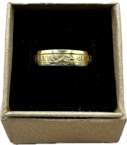U.S. Presidential Dollar Coin Ring (Reverse) 24k Gold Plated in a brown kraft box on a black velvet background. - Mountainstruck Coin Jewelry