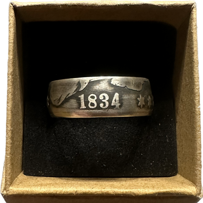 U.S. (Rare) Capped Bust Liberty Silver Half Dollar Coin Ring in a brown kraft box on a black velvet background. - Mountainstruck Coin Jewelry