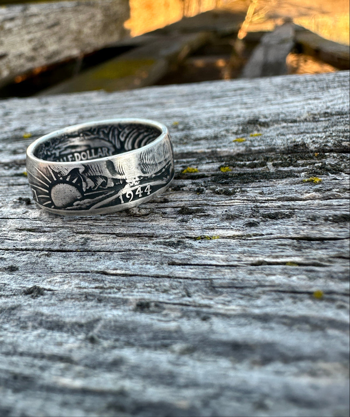 U.S. Walking Liberty Half Dollar Silver Coin Ring on a grey wood board. - Mountainstruck Coin Jewelry