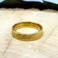 "V" Nickel Coin Ring 24k gold plated on a light wood round with a metal mountain background. - Mountainstruck Coin Jewelry