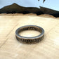WW2 Nickel Silver Coin Ring on a light wood round with a metal mountain background. - Mountainstruck Coin Jewelry